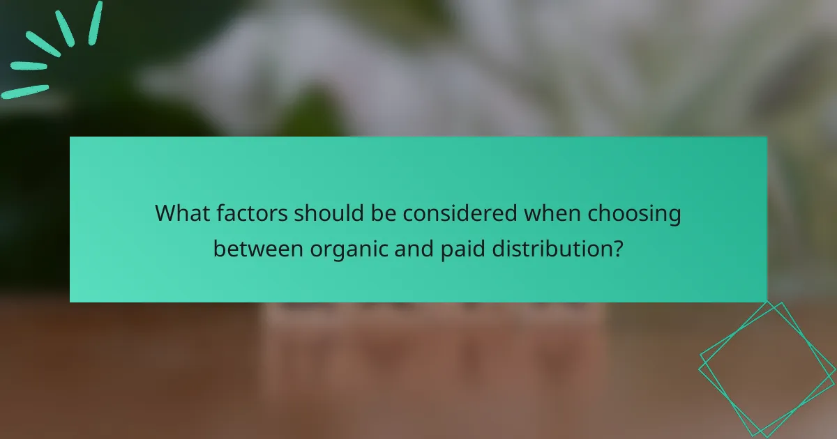 What factors should be considered when choosing between organic and paid distribution?